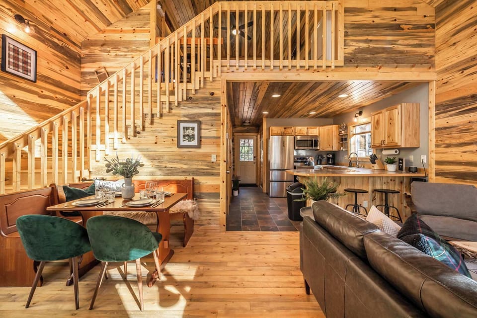 The cozy cabin is wrapped in natural beetle kill pine. Enjoy a loaded kitchen with eat-in bar, comfy living room with leather couch and 65" TV, and spacious master loft with desk area and a coffee station.