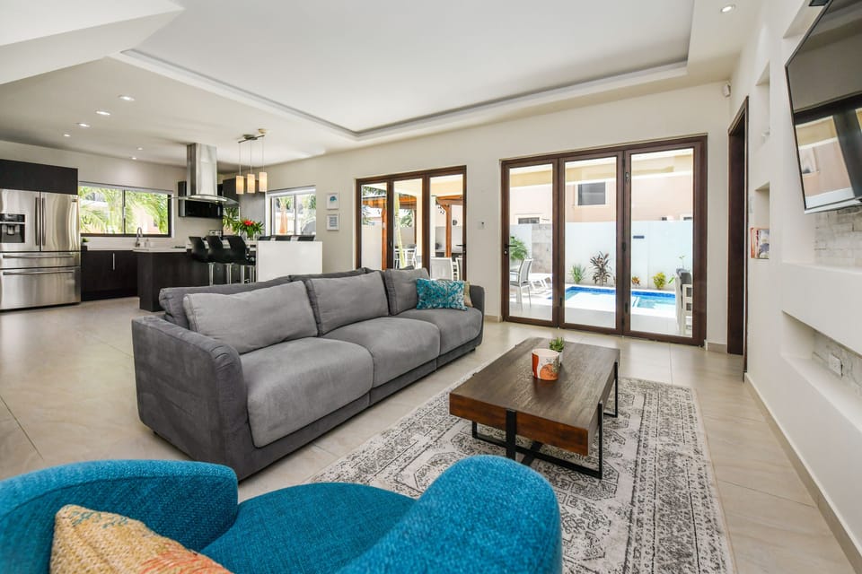 Large glass doors leading from the open-concept first floor to the backyard