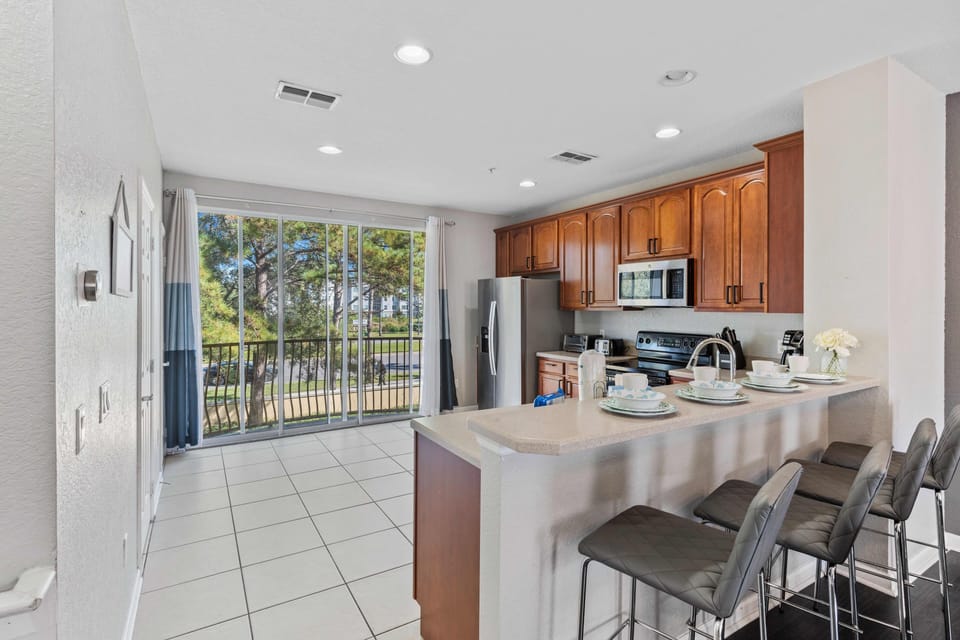 Culinary Haven: Immerse yourself in the modern charm of our fully furnished, open-concept kitchen – the perfect space for culinary adventures and socializing.