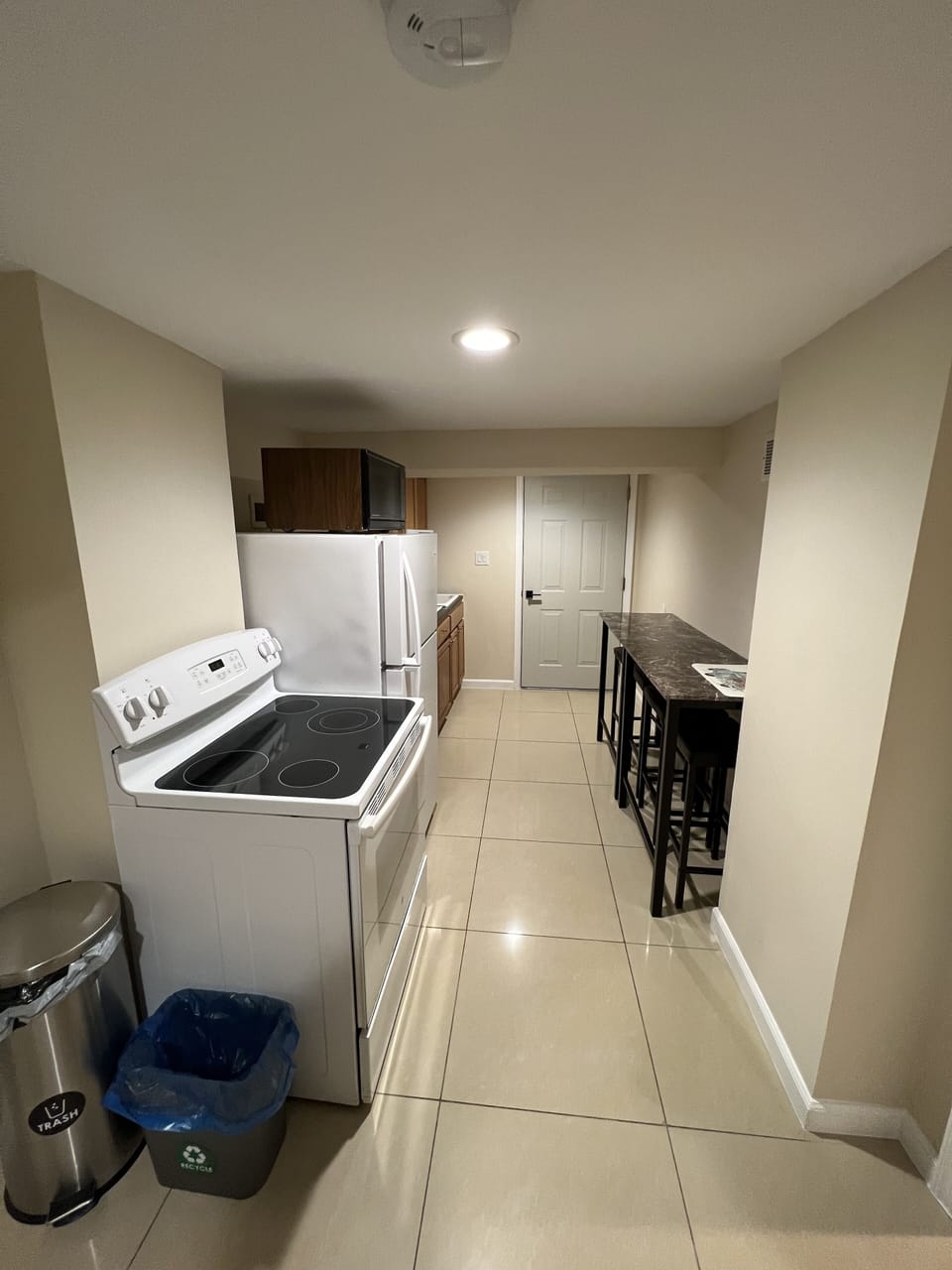 Kitchen with tables and bar stools 