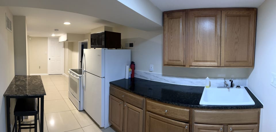 Kitchen with tables and bar stools 