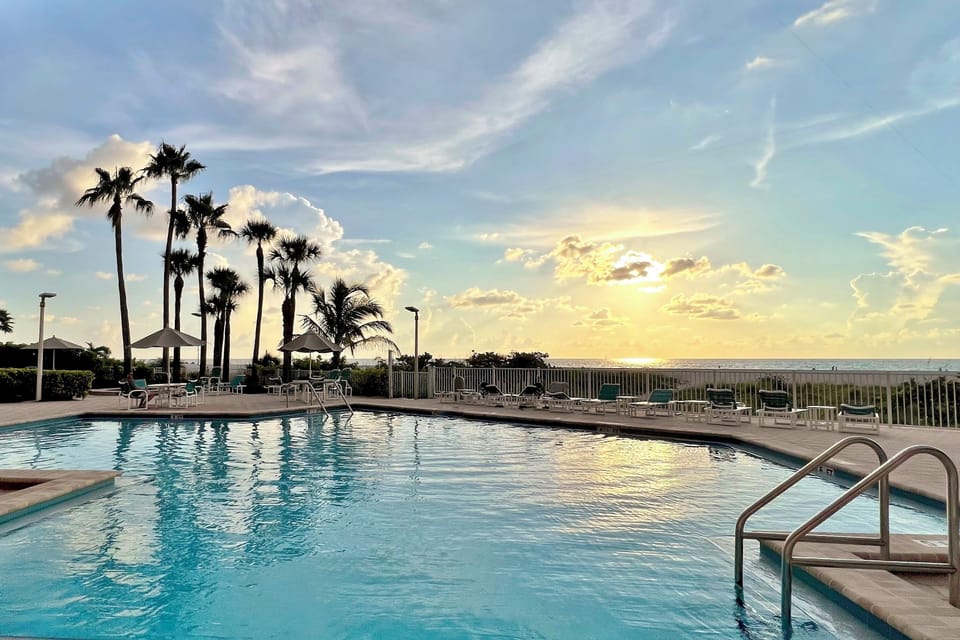 Enjoy stunning sunset views by the pool for a perfect evening retreat.