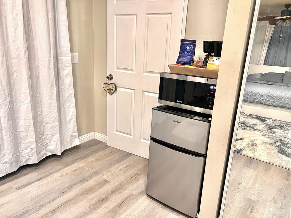 A mini refrigerator, coffee maker, 3 in 1 microwave, baking oven, and air fryer!