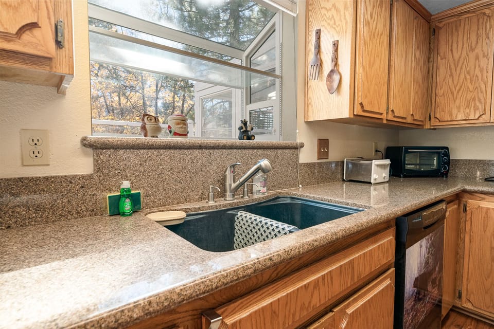 toaster oven, toaster and dishwasher in kitchen