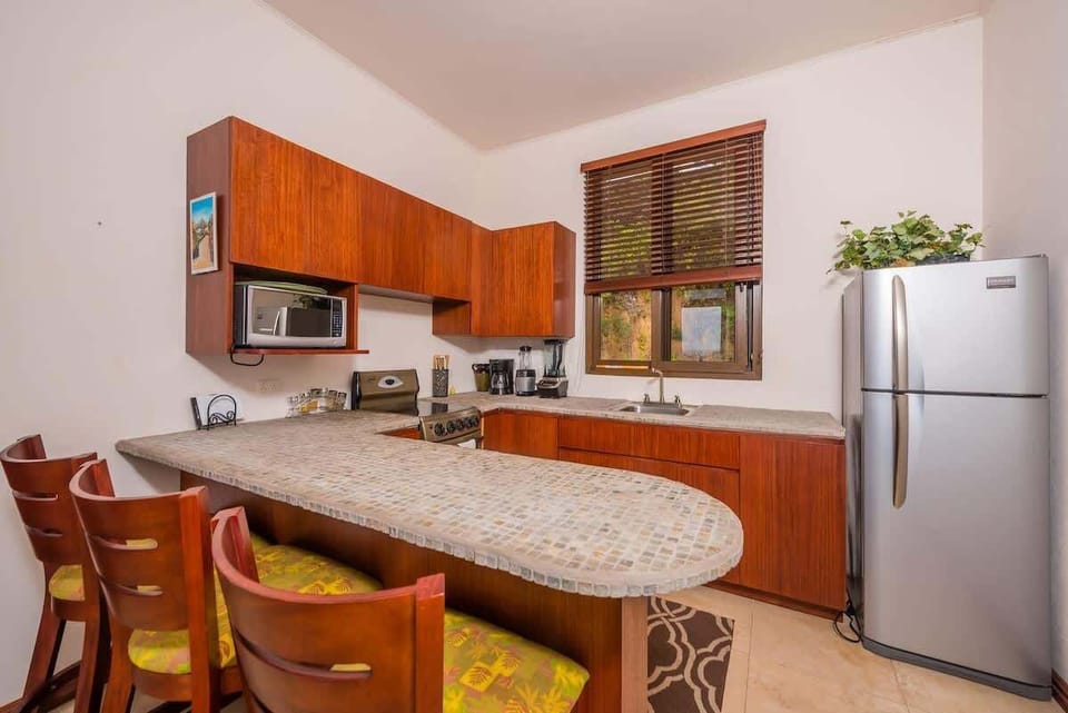 Open kitchen, stainless steel appliances, ocean views