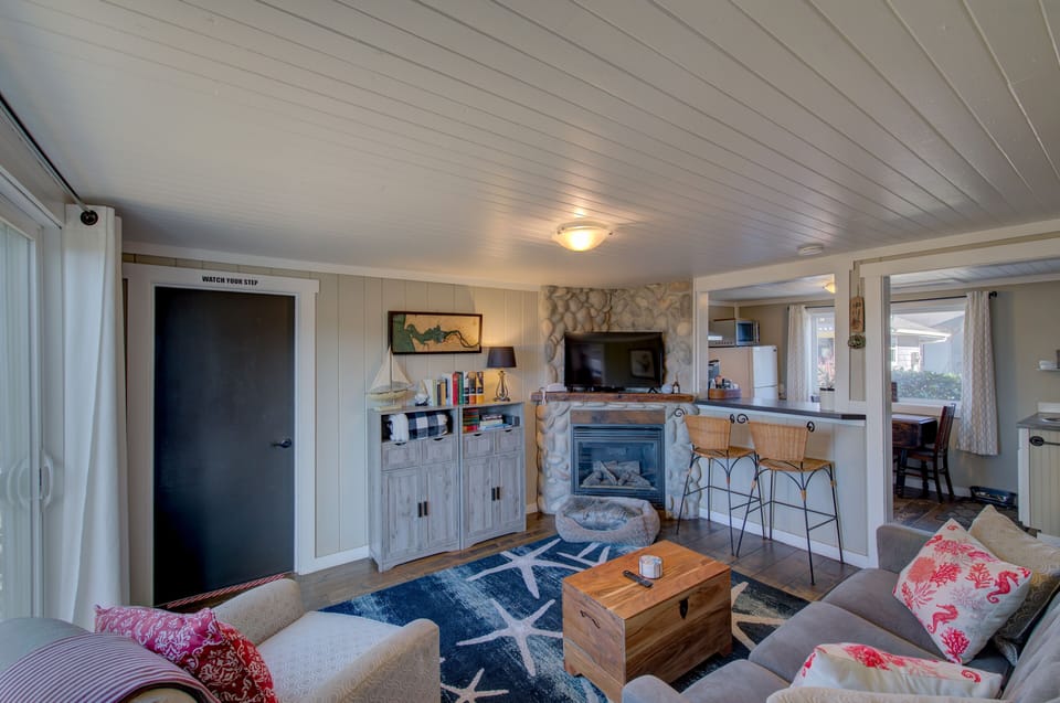 Living room with electric fireplace and dog bed
