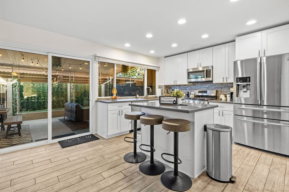 Kitchen opens up into back patio for easy access to enjoy the outdoor warmth 
