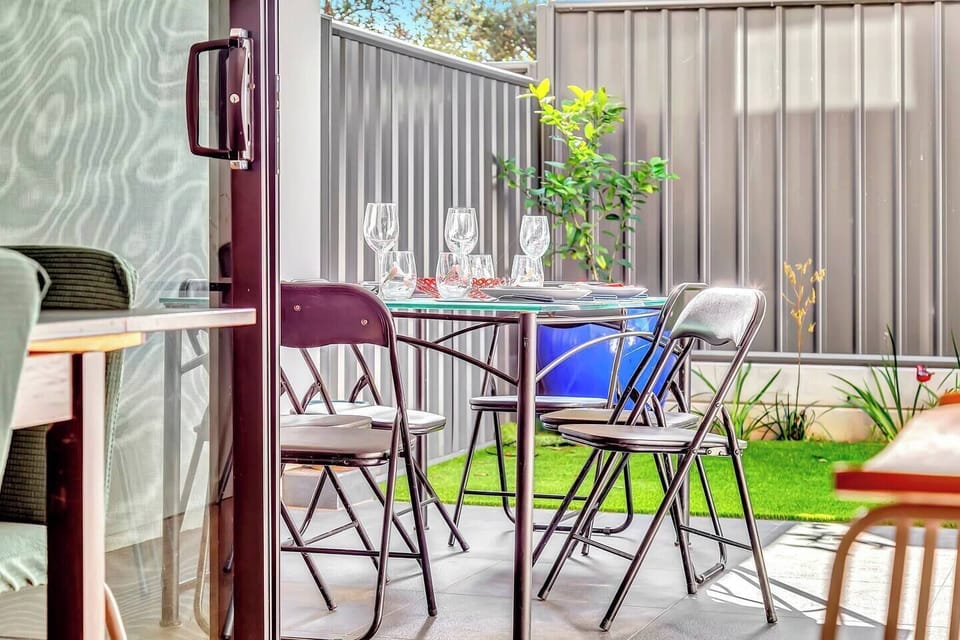 Dine alfresco out on the patio and enjoy a grassy backyard and BBQ.
