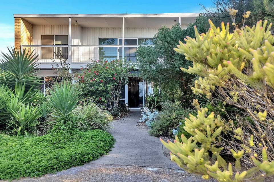 This two-storey home offers a fantastic beachside lifestyle within quiet tree-lined streets