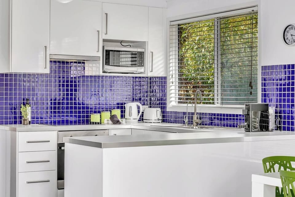 The stylish kitchen comes fully equipped with ample prep space for your holiday catering.
