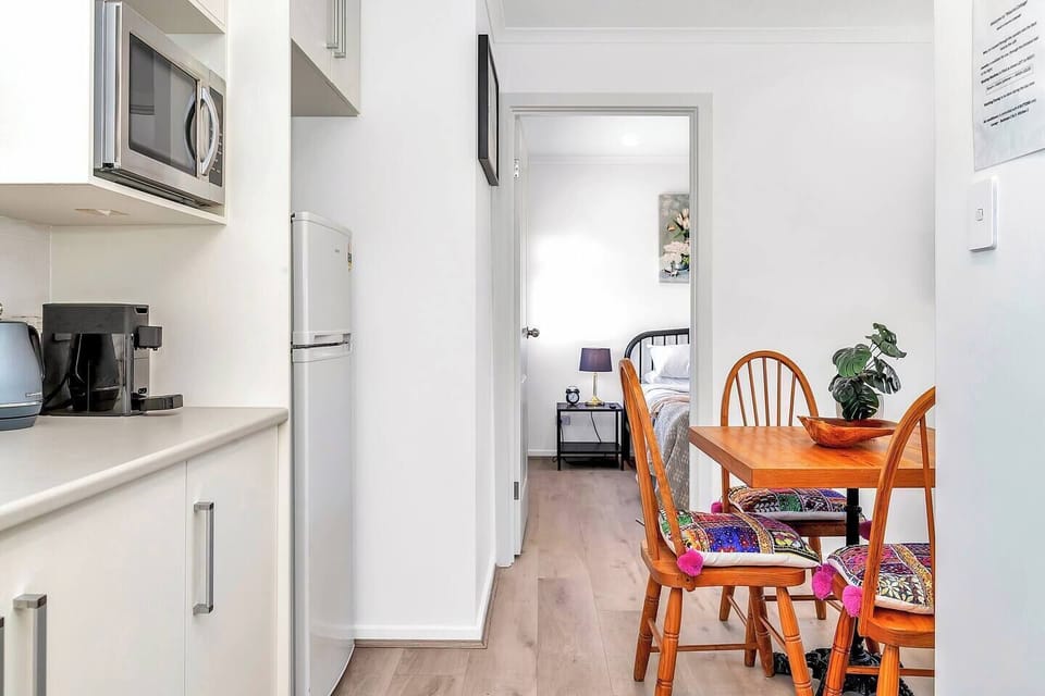 The modern kitchen has all the essentials needed to prepare light meals at home, including a fridge, microwave, kettle and toaster. 
