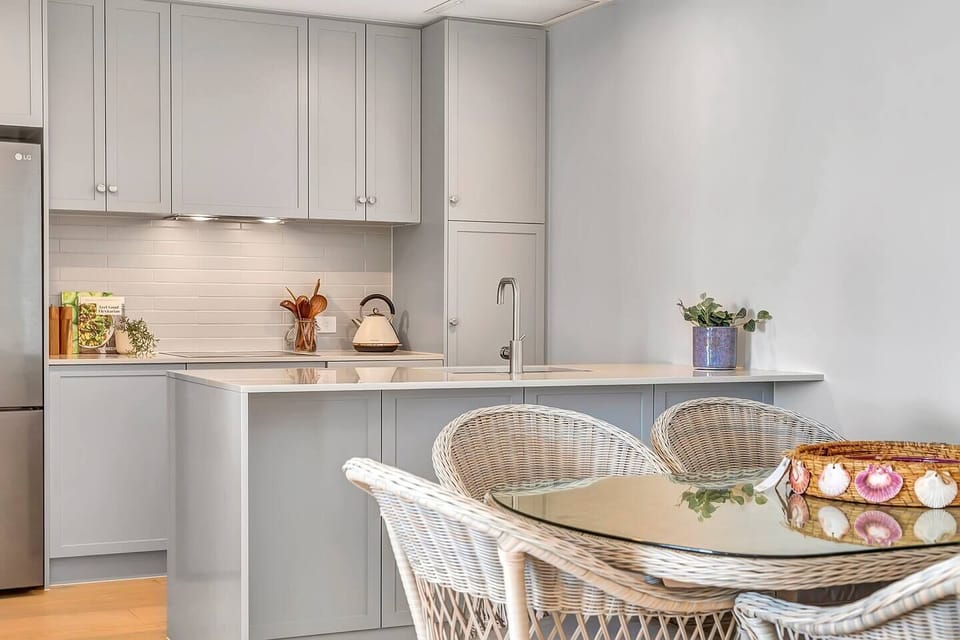 A gourmet Hamptons-style kitchen comes equipped with all the appliances and utensils needed to cook at home.
