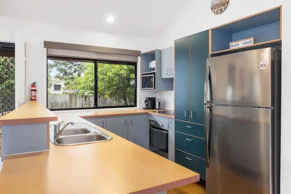 Fully equipped kitchen with modern amenities and pantry supplies