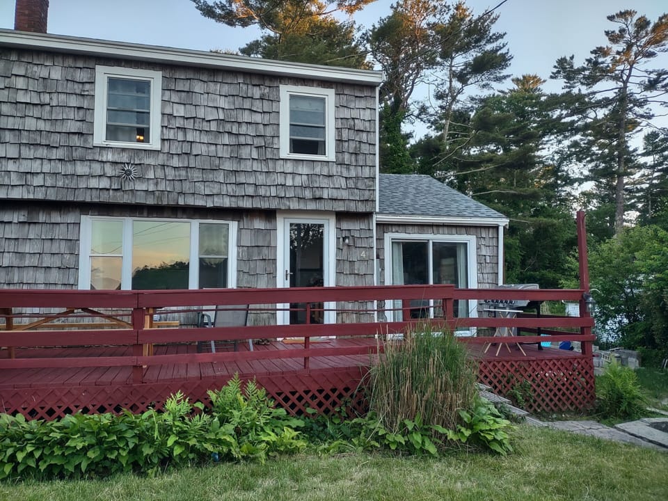 See the sunset reflected in the windows? That's the nightly view from the deck.