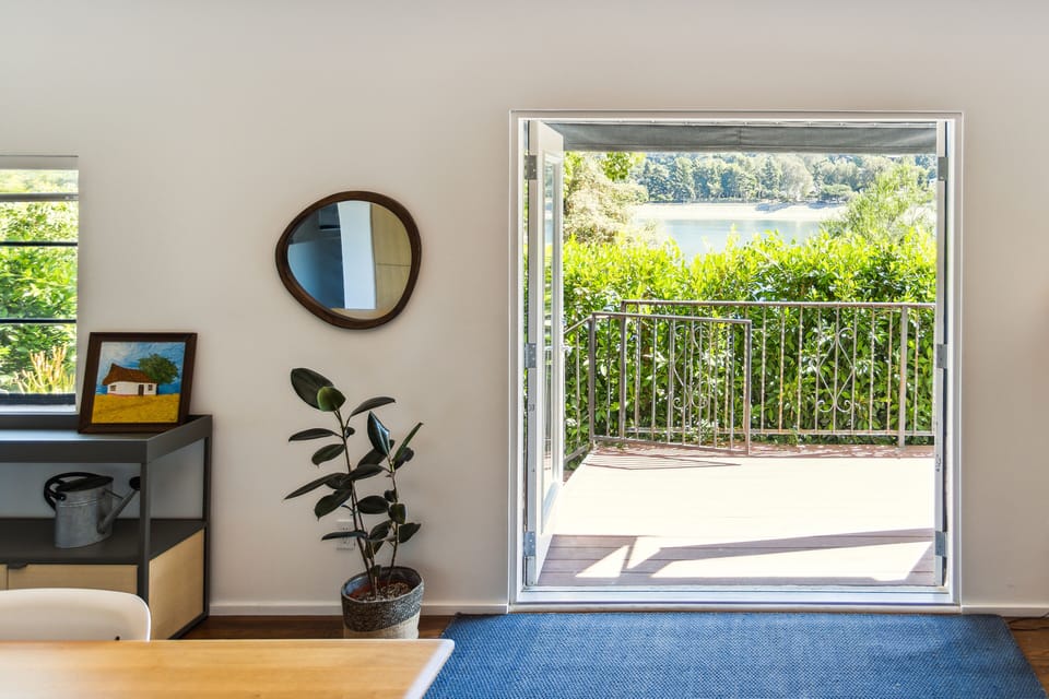 French doors opening to private patio overlooking Silverlake Reservoir