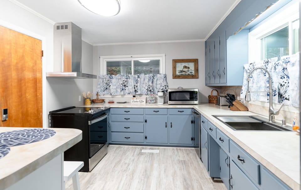 Full Kitchen with new Appliances and stocked with cooking utensils.
