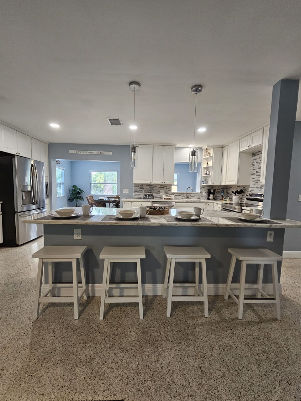 Kitchen area: central island with 4 bar stools,Refrigerator,stove,oven&many more