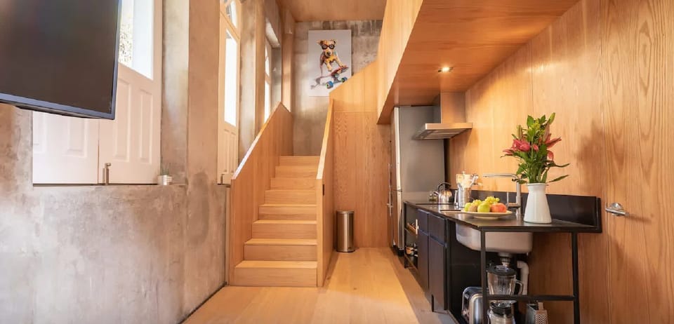 Kitchen with stainless appliances and dark cabinetry—everything you need to cook meals during your stay.
