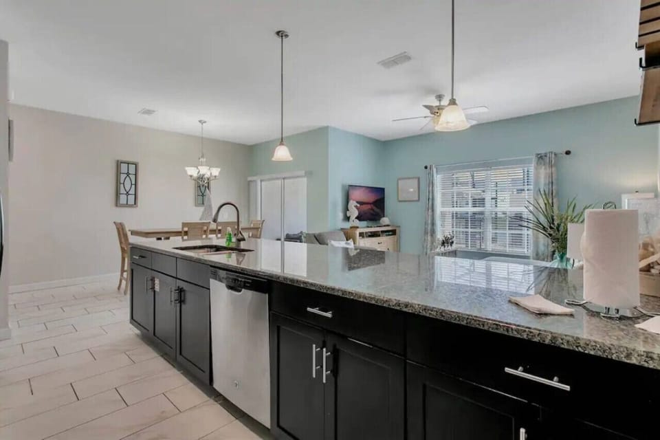 Modern kitchen counter with plenty of space for cooking and conversation.