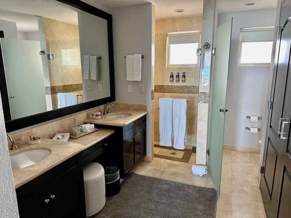 sinks, wardrobe and a shower 