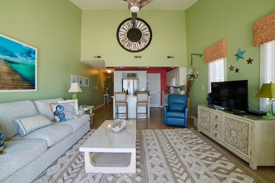 View from balcony into condominium, high ceilings
