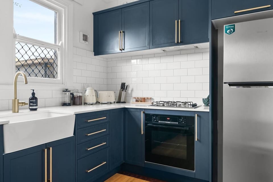 Equipped with top-notch appliances, this bold kitchen allows you to have home-cooked meals at home.
