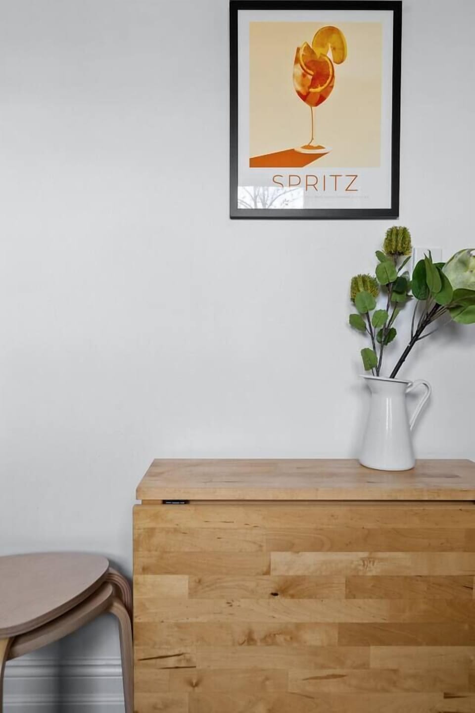 This fold-away dining table serves as a perfect spot for having meals and can be put aside to free up space.