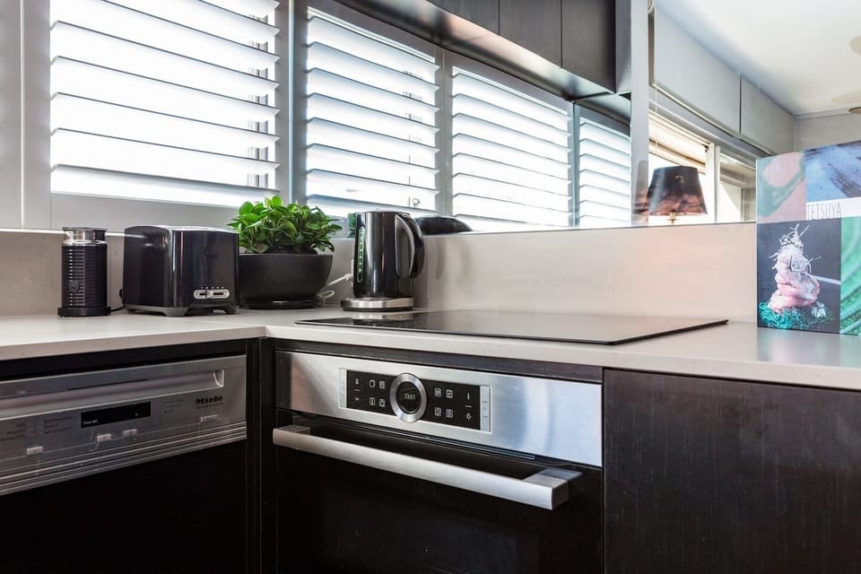 The kitchen is fitted out with premium appliances and all the essentials.