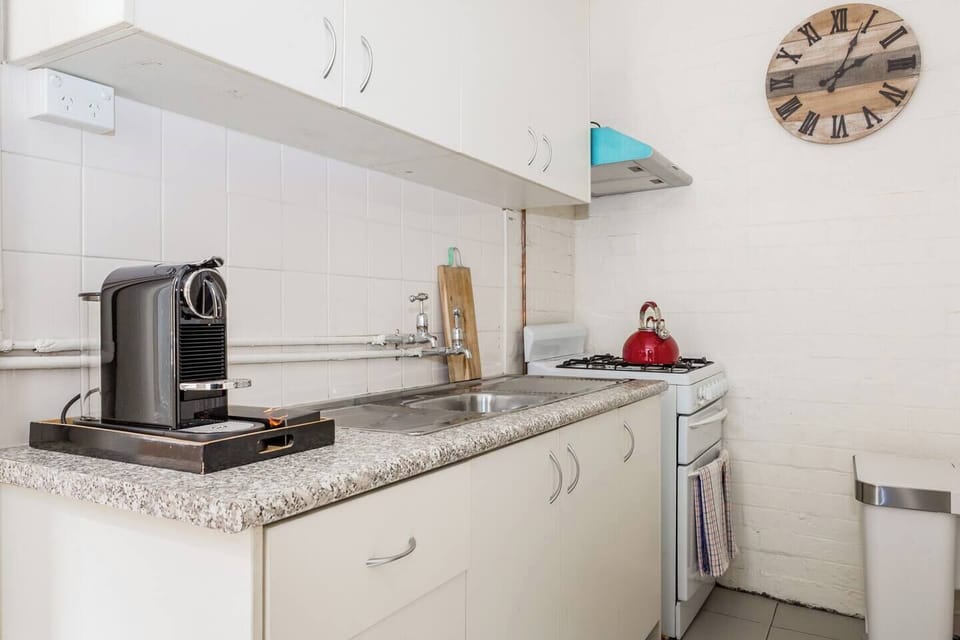 Whip up meals in the downstairs kitchen featuring all the essentials, plus a Breville microwave, SMEG fridge and Nespresso coffee machine