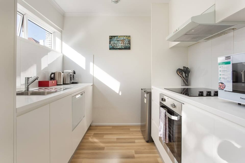 The fully-equipped kitchen offers a spacious and pristine place to prepare delicious meals or whip up something quick to eat