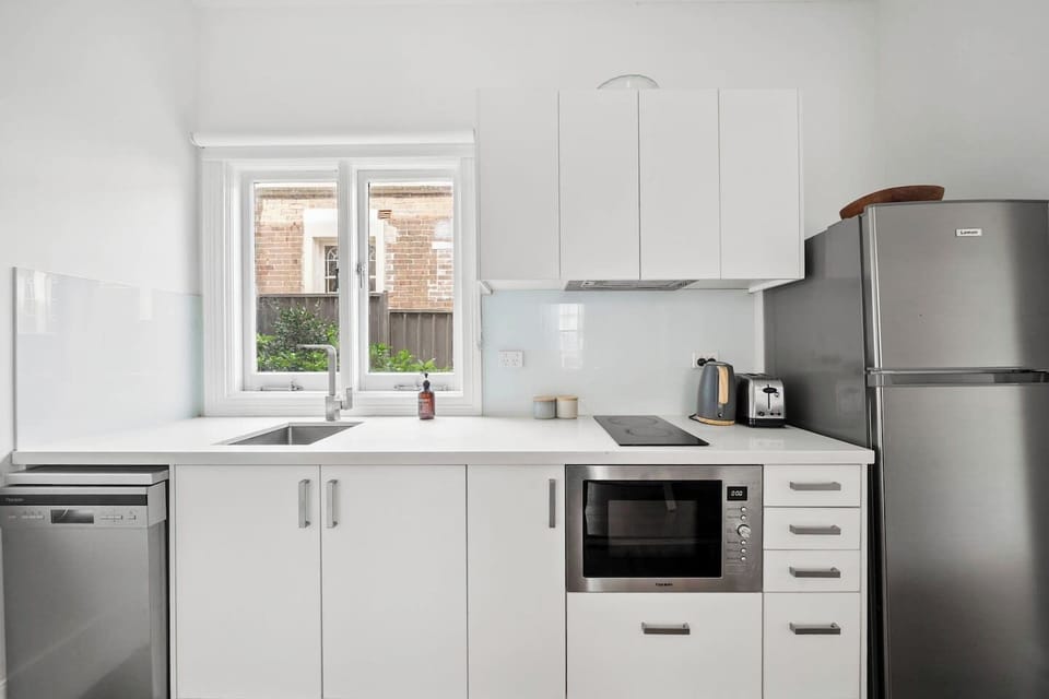 The compact kitchen is fully equipped with all your basic cooking essentials and appliances needed for meals at home.