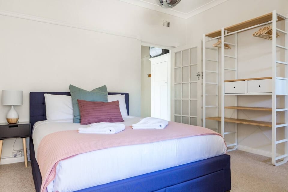 Retreat to a queen bedroom fitted with hotel quality linens and a wardrobe for your belongings.