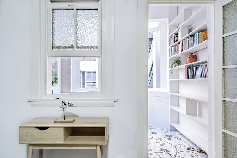 The apartment showcases classic art deco detailing with lovely spaces to unwind after a day exploring Sydney.
