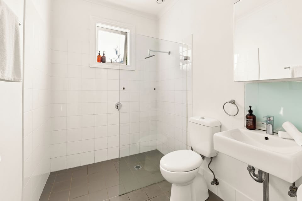 The bathroom is designed with a generous walk-in shower, toilet and vanity. There are premium amenities for you to use during your stay.