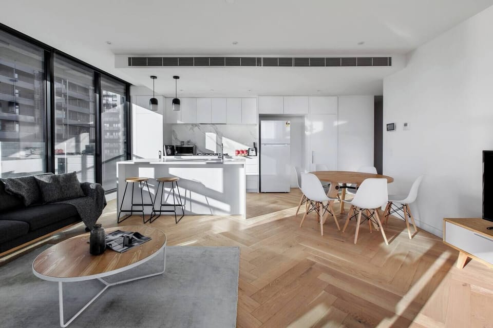 Comfortably wine and dine at the six-person dining table adjacent to the kitchen - perfect for a family or large group.