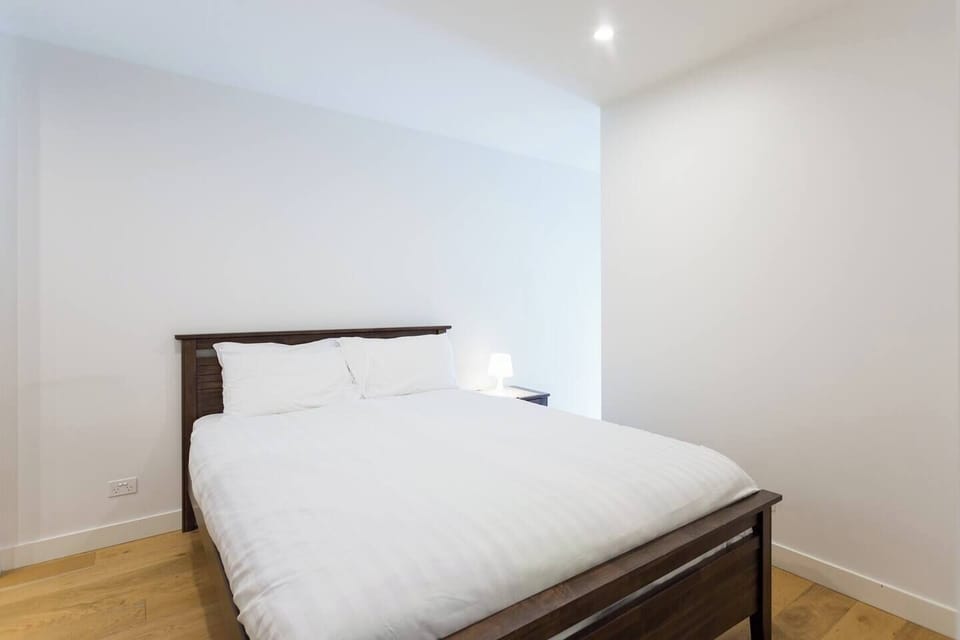 The master bedroom is replete with a plush queen bed, hotel quality linen and access to a private ensuite