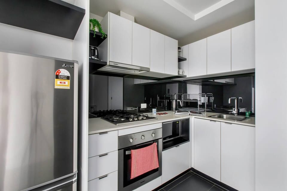  The kitchen is well equipped for meals at home with stainless steel appliances and modern cooking utensils.
