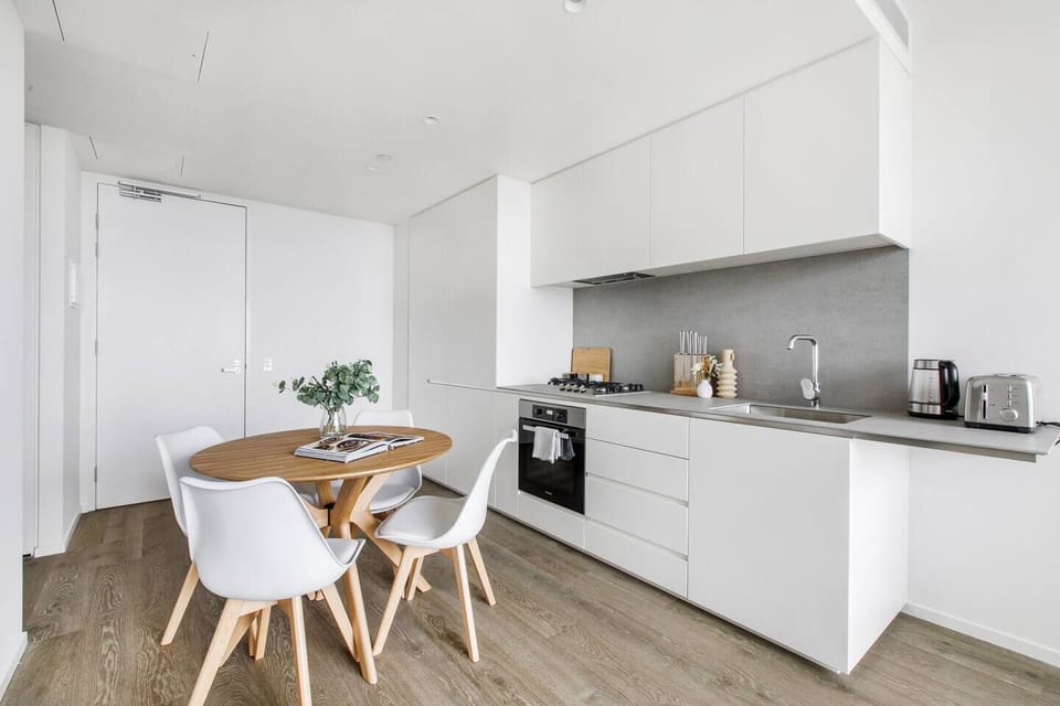  The modern, streamlined kitchen has everything you need to prepare meals at home. 
