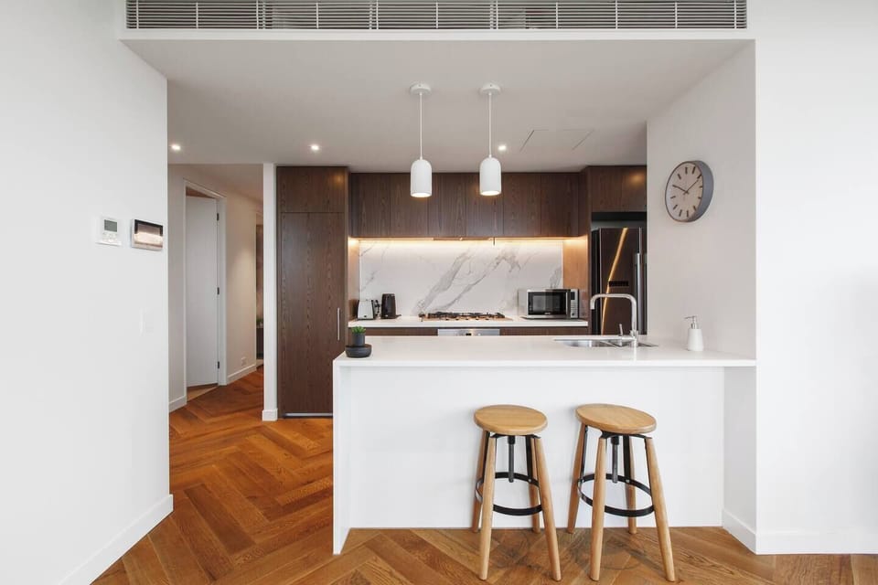 Whip up a meal in the designer centrepiece kitchen, equipped with stainless steel appliances and sleek stone.