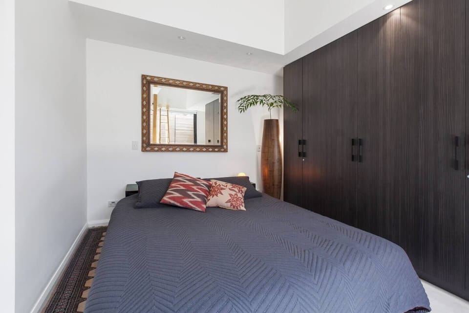 The bedroom is fitted with a sumptuous king-sized bed. There is a full wardrobe for storing your belongings.