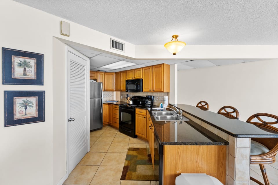 Fully Stocked Kitchen with Bar Seating