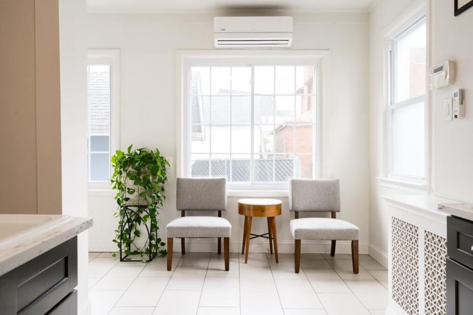Relax in our charming side entrance seating area, a cozy retreat with a welcoming ambiance.