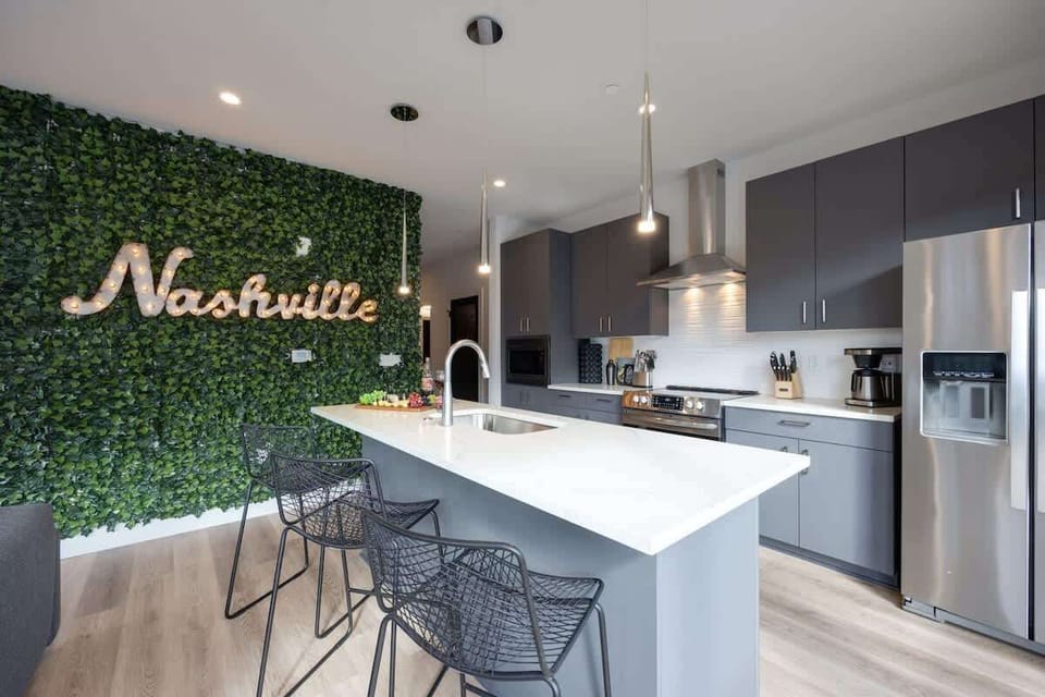 Fully equipped kitchen stocked with your basic cooking essentials, stainless steel appliances, and breakfast bar seating.