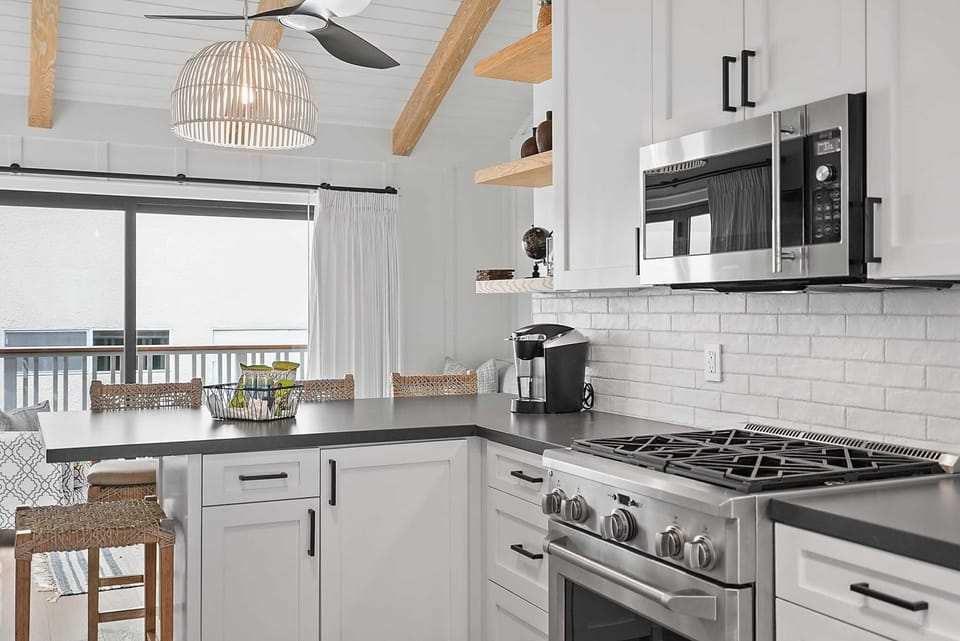 The kitchen is equipped with premium appliances and modern fixtures.