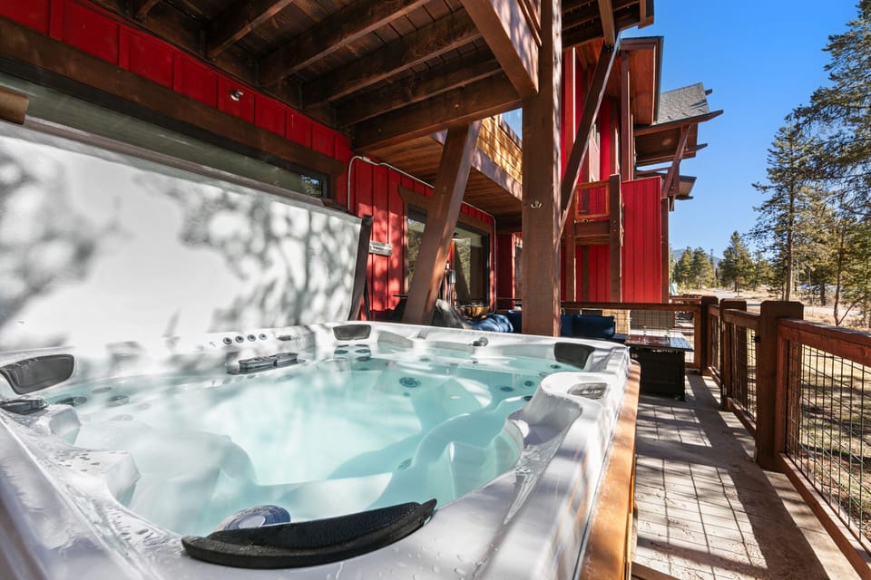 Unwind in your private hot tub on this sunny deck, where forest views and warm bubbles create the perfect mountain retreat.