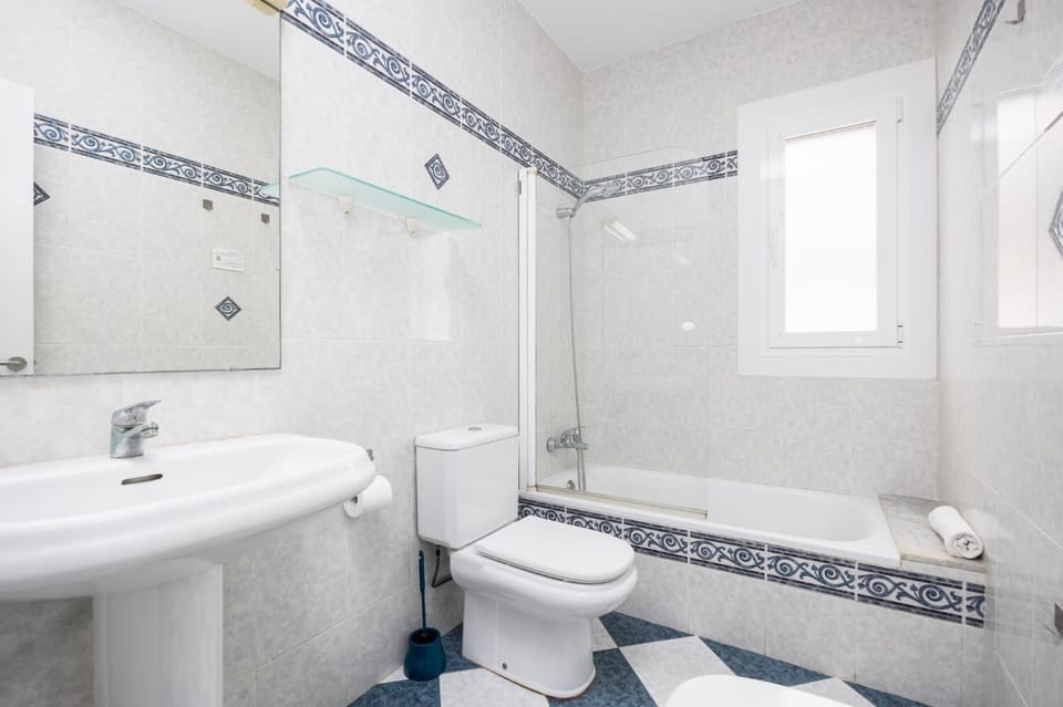 Family bathroom with bath and shower