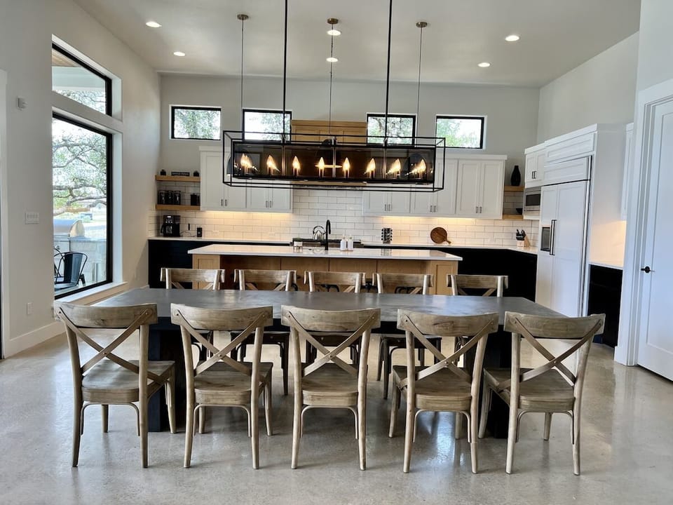Kitchen and dinning area overlook the lake and are open to living area