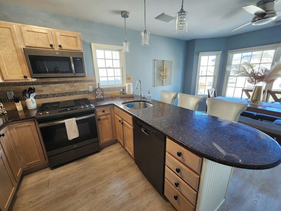 Well appointed kitchen with stainless steel appliances. 
