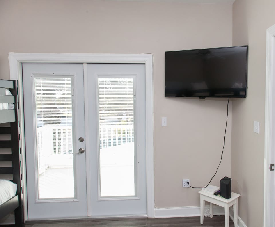 French doors to upstairs balcony.
