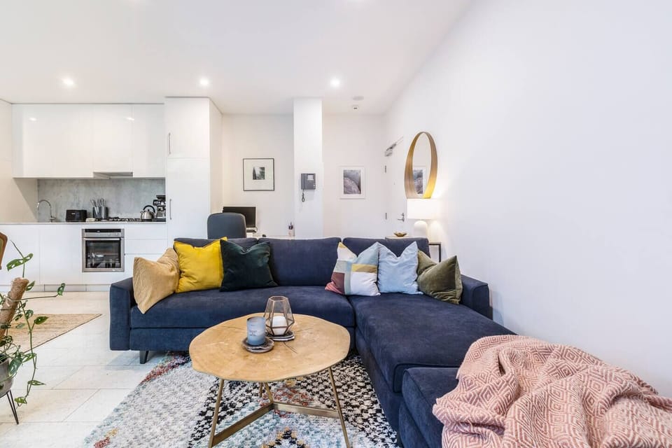 A large, comfy sofa and chaise offer ample seating to settle in with a movie after a day of work or sightseeing.